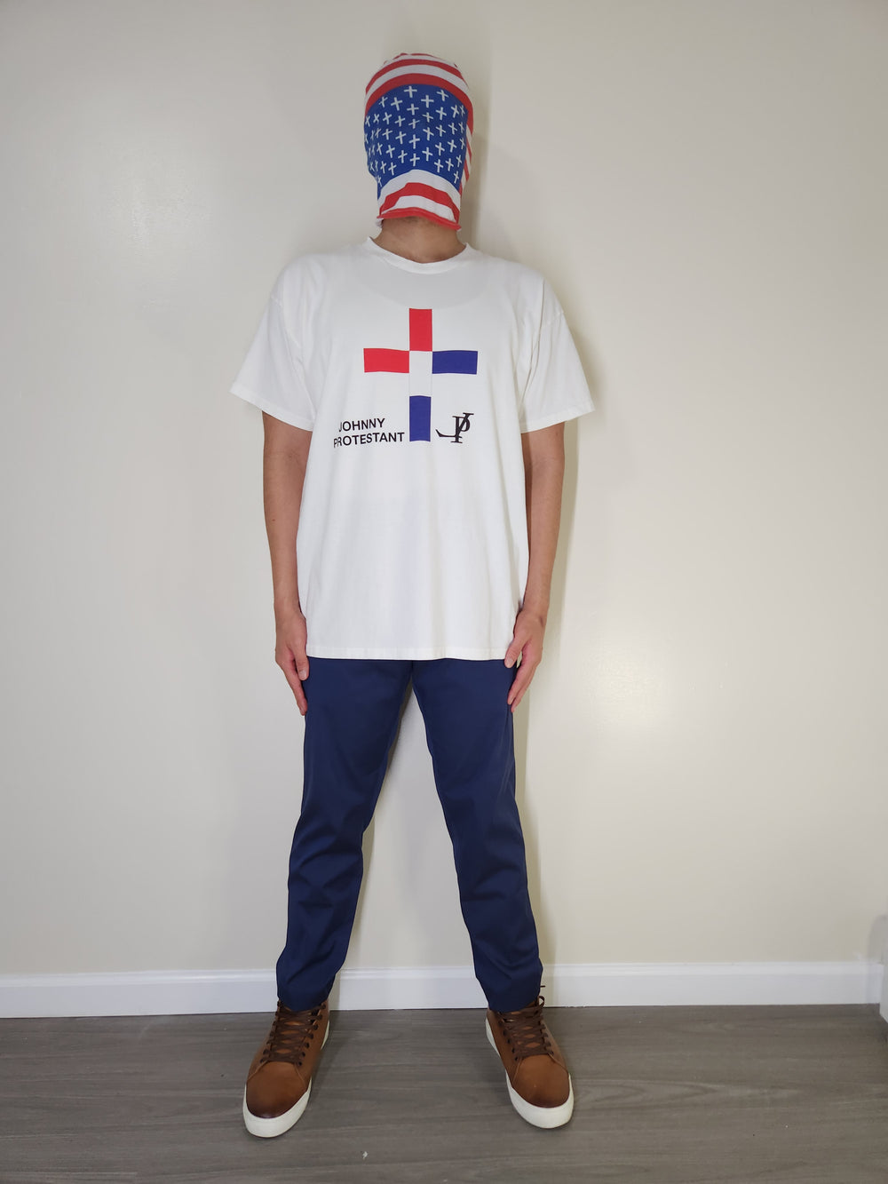 Model wearing The Johnny Protestant Cross white T-shirt, front view