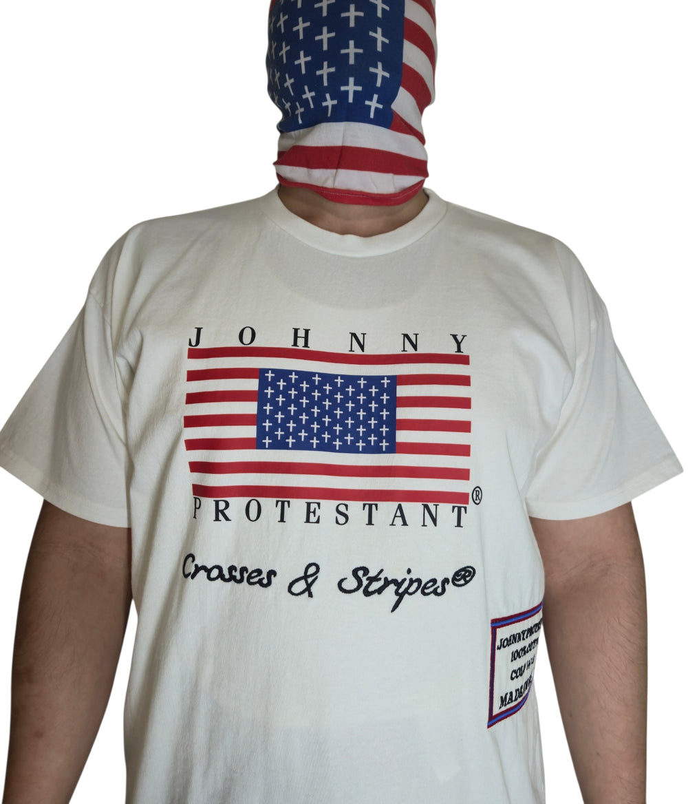 Close-up of model wearing ivory Clair Protestant Flag T-shirt with flag graphic